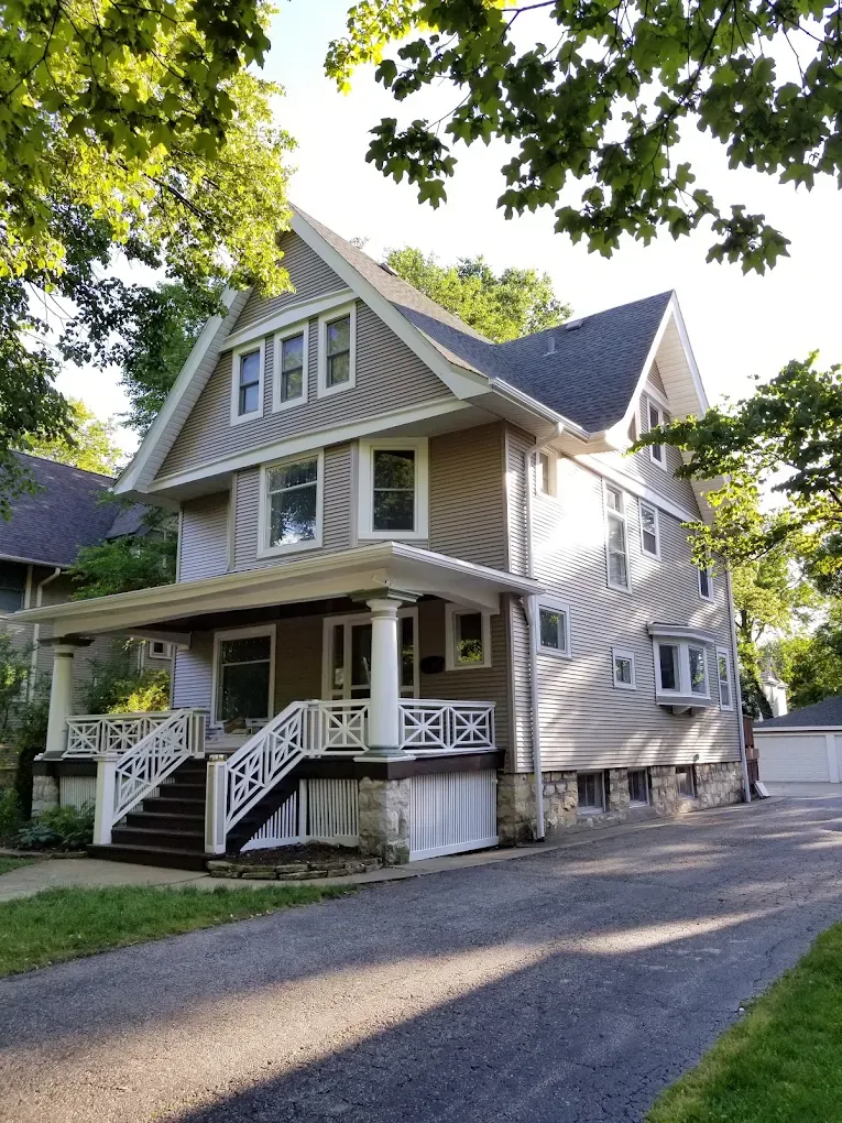 Gray craftsman home in Elmhurst, Illinois after a complete siding replacement by Durabuilt Home Improvements