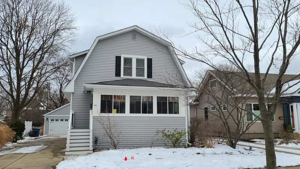 Dormer home in Elmhurst, Illinois after completed siding replacement, reviewed during the final Durabuilt follow-up