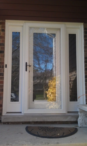 Full-view glass storm door installed over an entry door in Elmhurst, Illinois