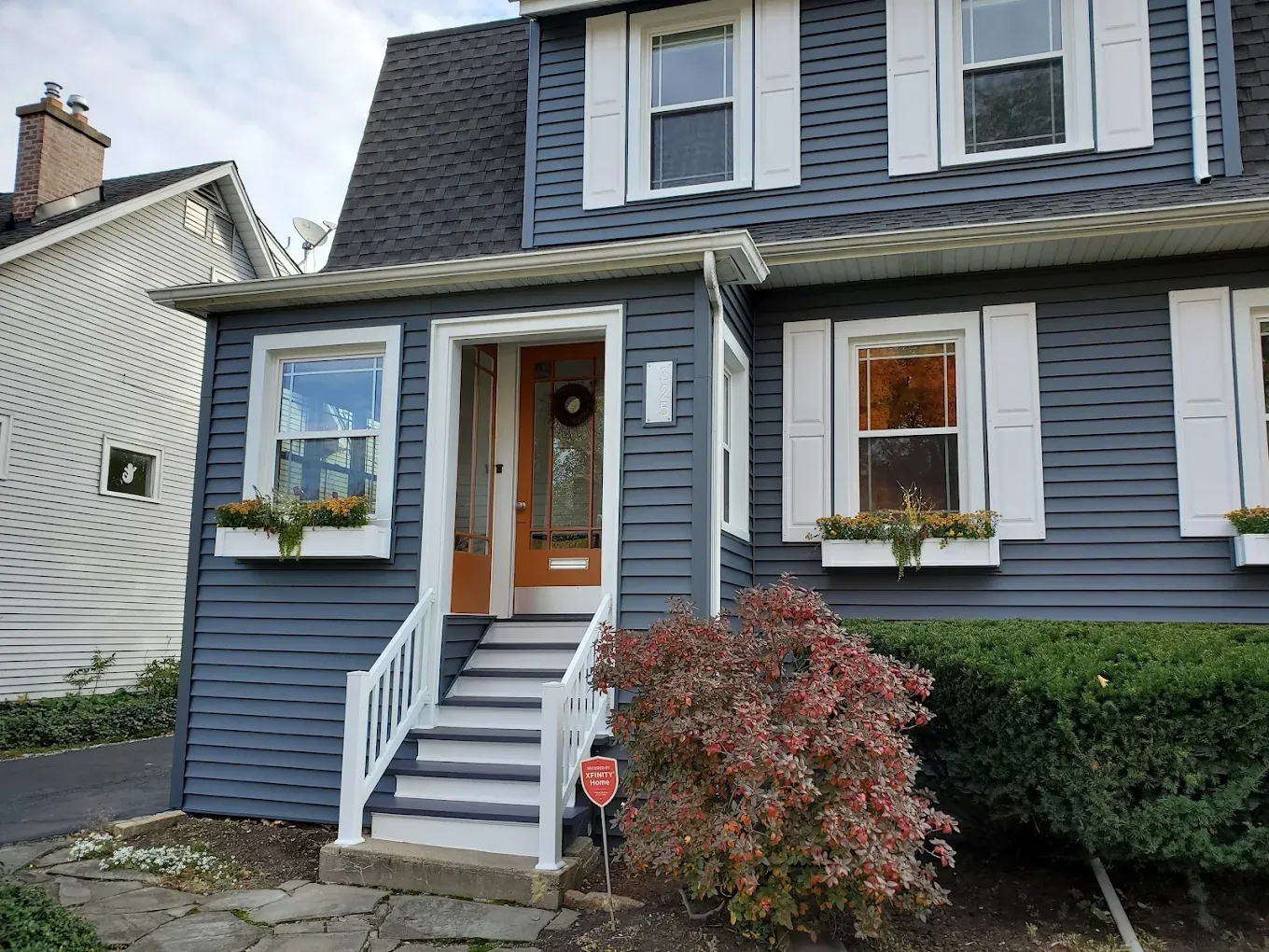 Blue lap siding replacement completed on a colonial home in Elmhurst, Illinois