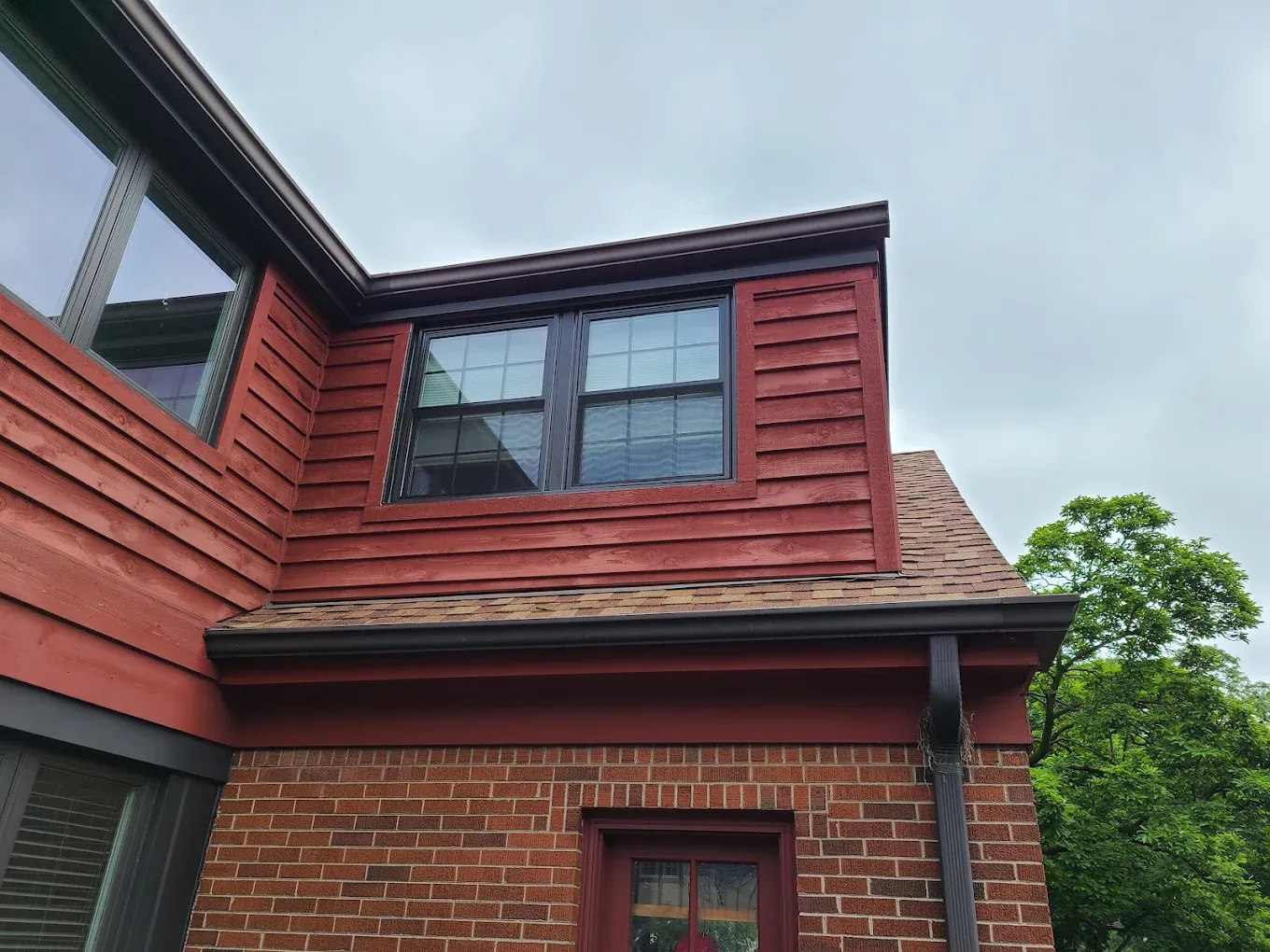 Custom dormer window replacement matched to the roofline of an Elmhurst, Illinois home