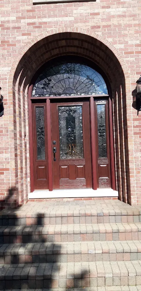 Entry door installation elmhurst arched wood — completed home improvement project by Durabuilt Home Improvements in the Elmhurst, Illinois area