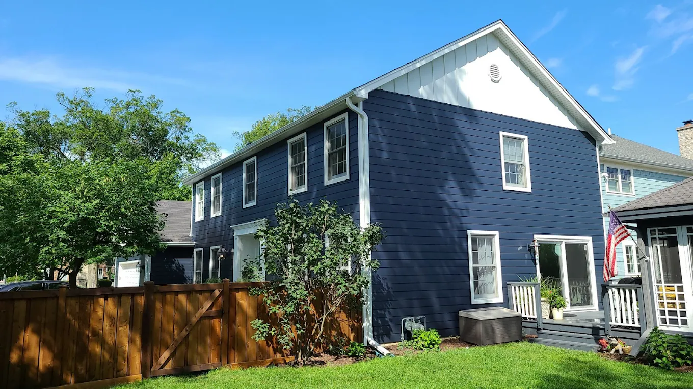 Blue side elevation of an Elmhurst, Illinois home with new siding installed by Durabuilt for a referred customer