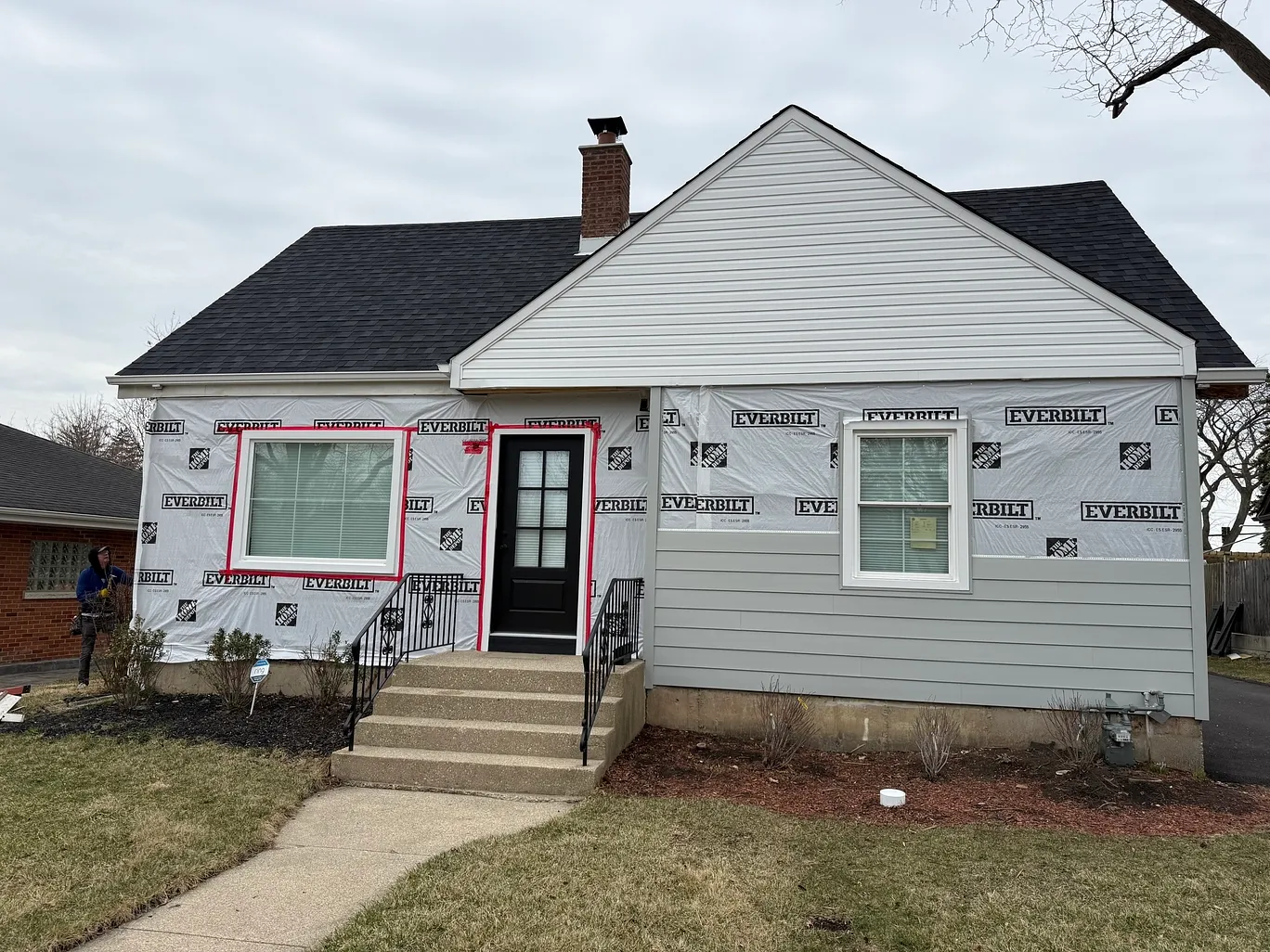 Cape cod home in Elmhurst, Illinois photographed with aging siding during a Durabuilt in-home consultation