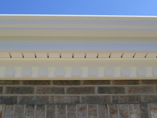Close-up of new white soffit, fascia and gutter along a home eave in Elmhurst, Illinois