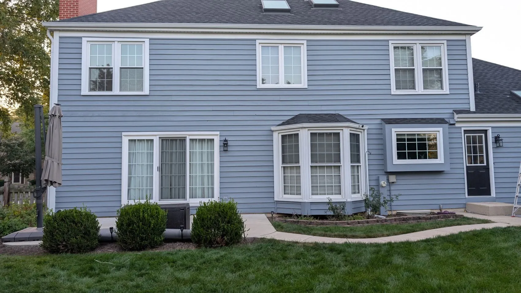 Polished completed siding and window replacement project on a two-story home in Elmhurst, Illinois